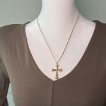 Gold tone cross pendant necklace